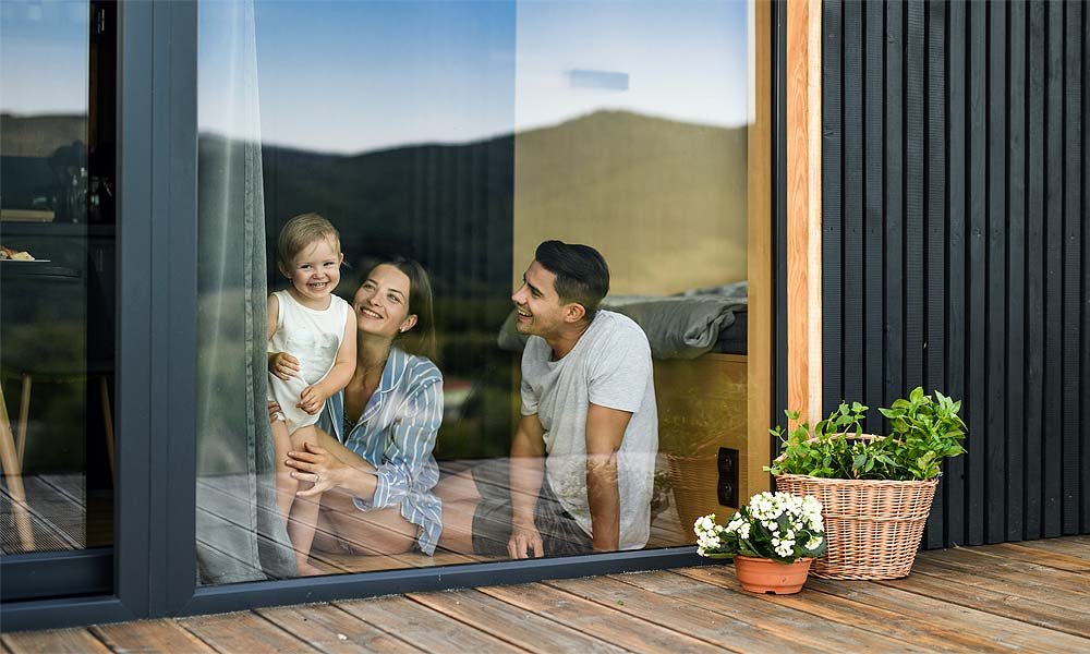 family in front of pvc windows